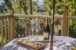 a bottle of champagne and two glasses on a table at 2 Bed in Brecon oc-t32728 in Brecon