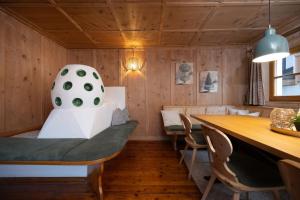 a dining room with a chair and a table at Ferienhaus Valsora in Sölden +37 photos