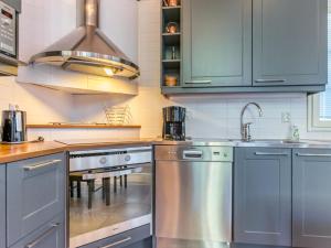 a kitchen with stainless steel appliances and a sink at Holiday Home Otso by Interhome in Pyhätunturi