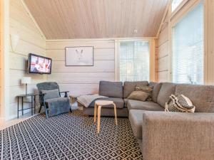 a living room with a couch and two chairs at Holiday Home Otso by Interhome in Pyhätunturi