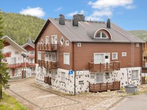 an apartment building with a mural on the side of it at Holiday Home Levinkolmio c6 by Interhome in Levi