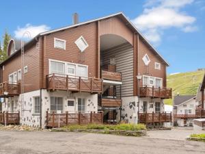 an apartment building with a large arched doorway at Holiday Home Levinkolmio c6 by Interhome in Levi
