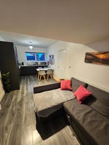 a living room with a couch and a table at Market Quarter Apartment, town centre, free parking and wifi in Southport +11 photos