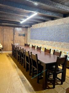 a long wooden table and chairs in a room at Casa El tio Daniel in Bargas +57 photos