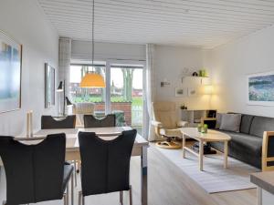 a living room with a couch and a table at Apartment Elevus - 10m from the sea by Interhome in Bogense