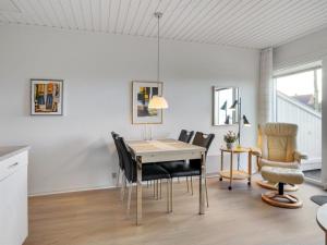 a dining room with a table and chairs at Apartment Elevus - 10m from the sea by Interhome in Bogense