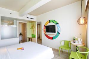 Letto o letti in una camera di MaxOneHotels at Bukit Jimbaran