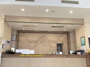 a large mural on the wall of a store at Shanghai Clivia Hotel in Shanghai