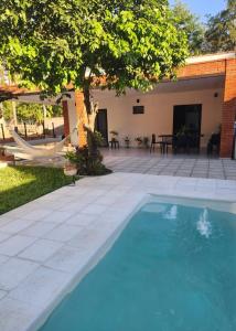 a swimming pool in the yard of a house at La Calma San Bernardino in San Bernardino
