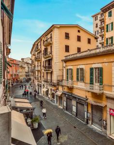 a group of people walking down a city street at Il Fiore del Prione in La Spezia