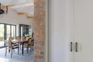a dining room with a table and chairs at Great Heart Farm in Montagu +26 photos