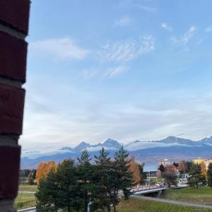 a view of the mountains from a building at Panorama Tatry Apartment in Jezersko