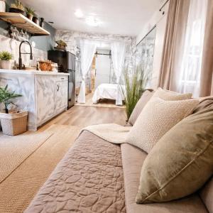 a living room with a couch and a kitchen at Social Distanсing Approved Nature Getaway! in Naples +12 photos