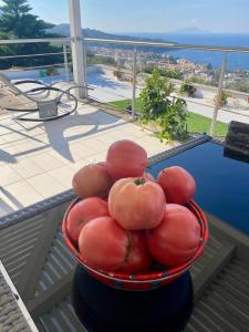a bowl of tomatoes sitting on top of a balcony at Villa Ice Sorrento in Sorrento