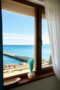 a window with a view of the ocean at Apartment Sea Sunrise, complex Carpe Diem, FREE PARKING in Balchik