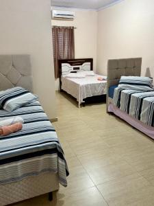 a room with two beds in a room at Hotel Consalter in Rodeio Bonito +28 photos