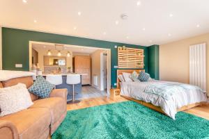 a living room with a couch and a bed and a kitchen at 1 Bed in Far Forest oc-d30808 in Rock