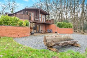 a house with a wooden bench in front of it at 1 Bed in Far Forest oc-d30808 in Rock