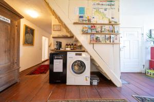 a washer and dryer in a room with a staircase at Alandblick in Wanzer +45 photos