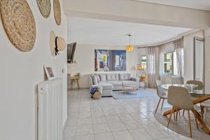 a living room with a couch and a table at Fabulous central apartment close to the sea! in Chalkida