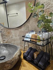 a bathroom with a large mirror and a bath tub at addview 2 in Nafplio +31 photos