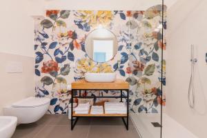 a bathroom with a sink and a mirror at Il Bagnolo Eco Lodge in Salò