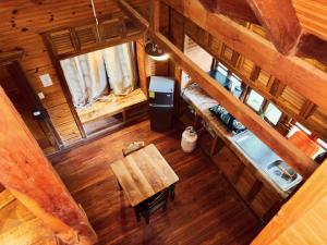 an overhead view of a cabin with a table and a bed at Hotel Mandacarú Puerto Viejo in Puerto Viejo