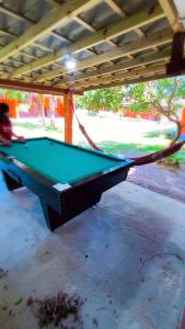 a pool table sitting under a pavilion at Pousada da Heloisa in Imbituba
