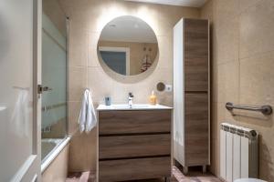 a bathroom with a sink and a mirror at Apartamento Ponent Stays in Almacellas