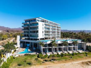 an aerial view of a resort with a swimming pool at Zantamar 105B, a pie de playa in Cruz de Huanacaxtle