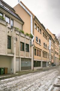 an empty street in front of a building at Schlossberg Residence in Freiburg im Breisgau