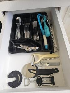 a drawer filled with lots of kitchen utensils at Sandy Cove in Christ Church