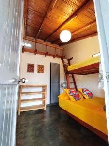 a room with two bunk beds and a door at Casa Naranja in Máncora +68 photos