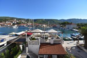 a view of a marina with boats in the water at Villa Radovani Jelsa Hvar in Jelsa