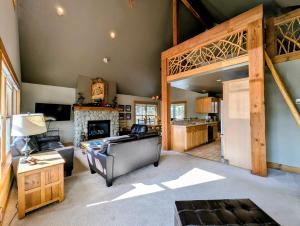 a living room with a couch and a fireplace at Cabin in the Pines 4 by SummitCove Lodging in Colorado in Keystone