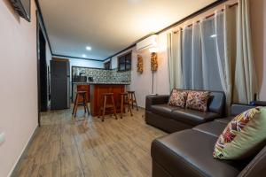 a living room with a couch and a kitchen at San Gabriel Apartments in Fortuna
