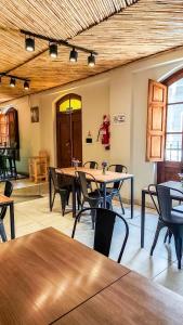 a dining room with tables and chairs in a room at Hotel Belgrano in Tilcara