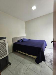 a bedroom with a bed and a air conditioner at Maria Bonita Apartment | Cozy, 10 minutes from the city center in Caruaru