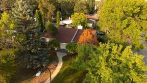 an overhead view of a house with trees and a driveway at 3 cozy bedrooms 2 bathrooms in Winnipeg