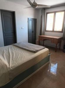 a bedroom with a bed with a keyboard on top of it at Casa Laguna in Iznájar