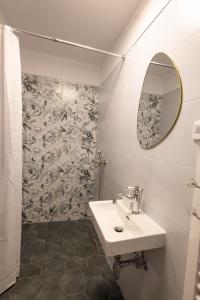 a bathroom with a sink and a mirror at Lavender farm Zarić in Porosanica +21 photos