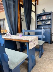 a blue table and two chairs and a table and a table and chairs at Lavender farm Zarić in Porosanica