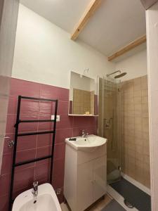 a bathroom with a sink and a toilet and a shower at Hotel Regina Yeti Bistrot in Sestola +141 photos