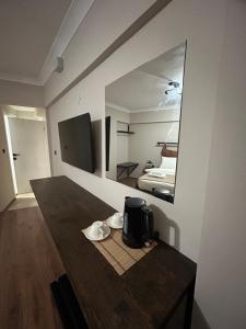 a room with a table with a coffee maker and a mirror at Pera Line Yalova in Yalova +63 photos