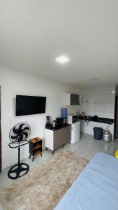 a room with a kitchen with a bed and a table at Vitallino Apartment | Modern with A/C, 10 min from the City Center in Caruaru +5 photos