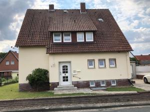 a white house with a brown roof at Gästehaus Stadthagen in Stadthagen +12 photos