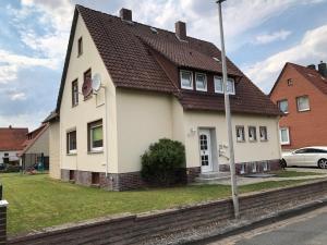 a white house with a brown roof at Gästehaus Stadthagen in Stadthagen