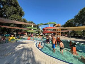 a group of people playing in a water park at Bázis Vendégház Hajdúnánás in Hajdúnánás