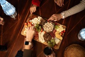 a group of people sitting around a table with a plate of food at Tierra Mia Hacienda Ruta del Vino in Valle de Guadalupe +60 photos
