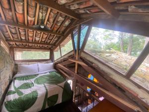 a room with a bed in a tree house at El Refugio de los Ángeles in San Antonio del Tequendama +30 photos